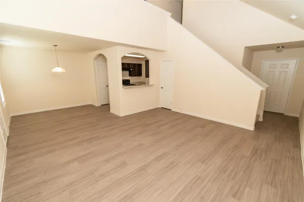 a view of a kitchen cabinets and wooden floor