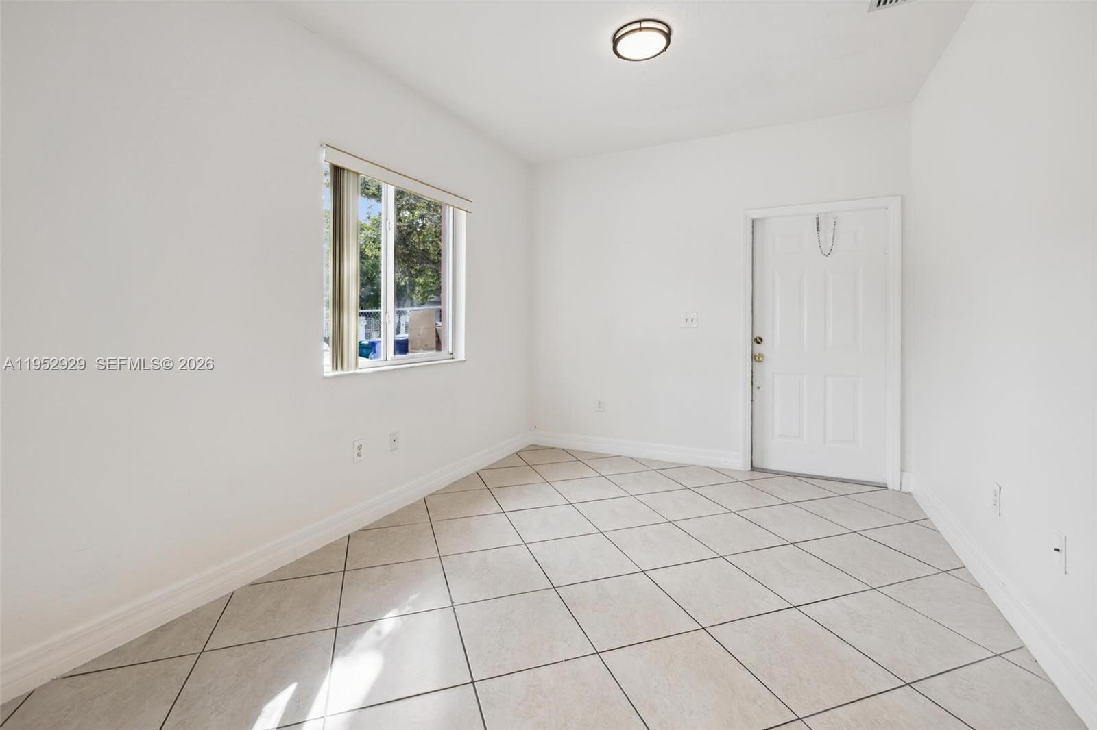 3134 Hibiscus Street, Unit 3134 Miami, FL 33133 - Photo 11 of 21 a view of an empty room and window