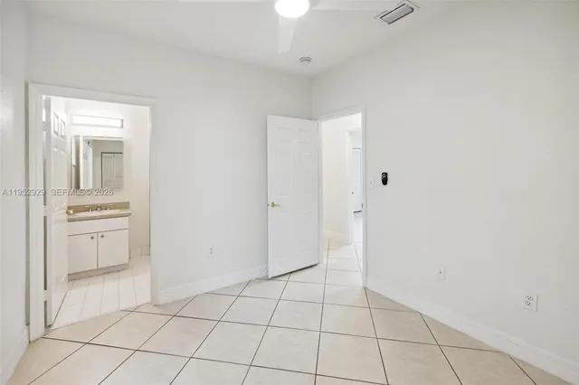 a view of a storage & utility room with a sink
