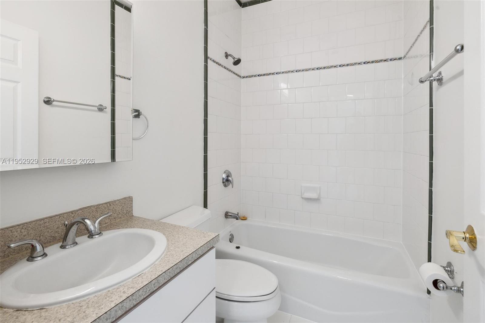 3134 Hibiscus Street, Unit 3134 Miami, FL 33133 - Photo 9 of 21 a bathroom with a sink toilet and shower