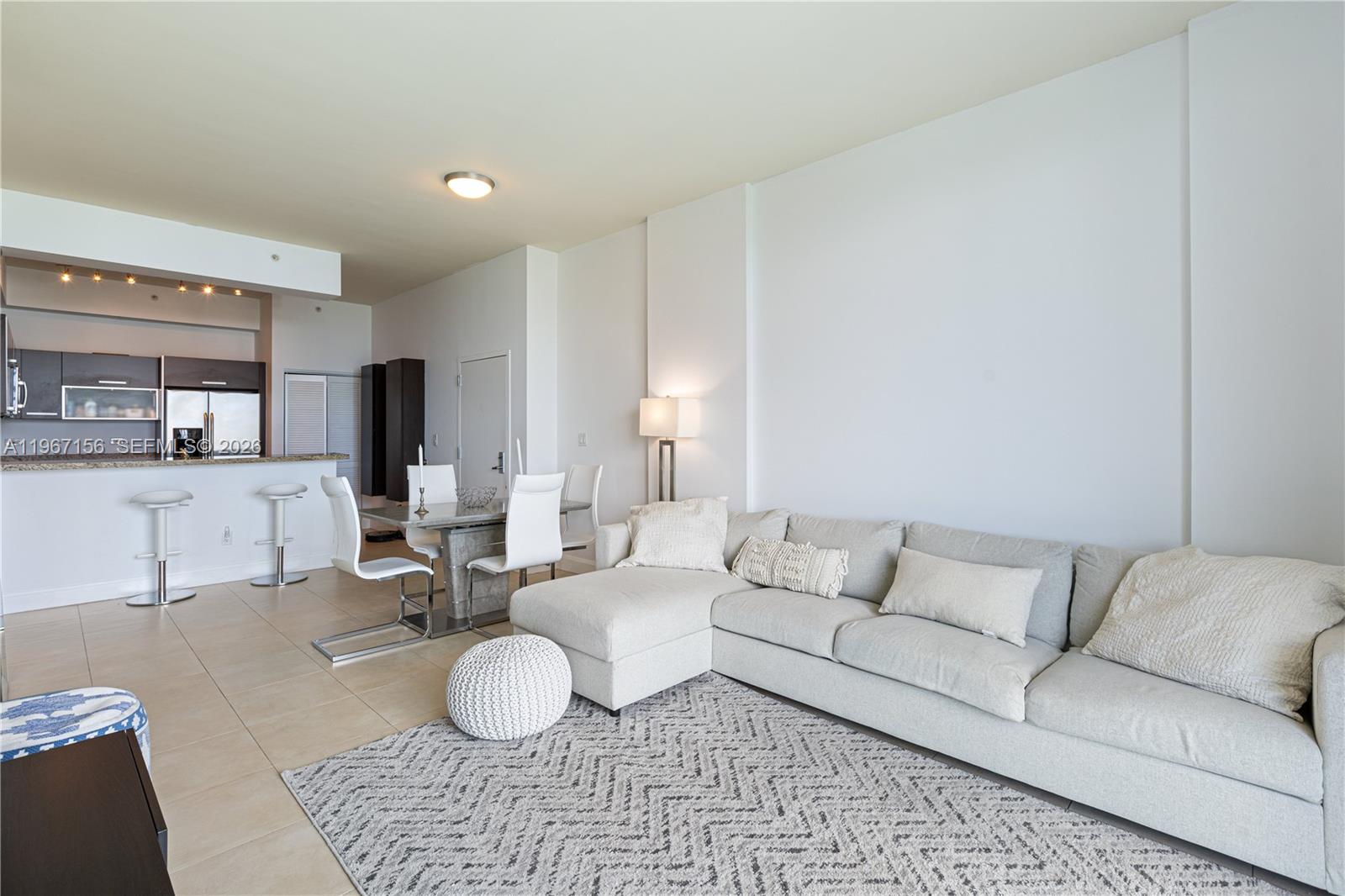 2525 Southwest 3rd Avenue, Unit 1708 Miami, FL 33129 - Photo 14 of 26 a living room with furniture and a wooden floor