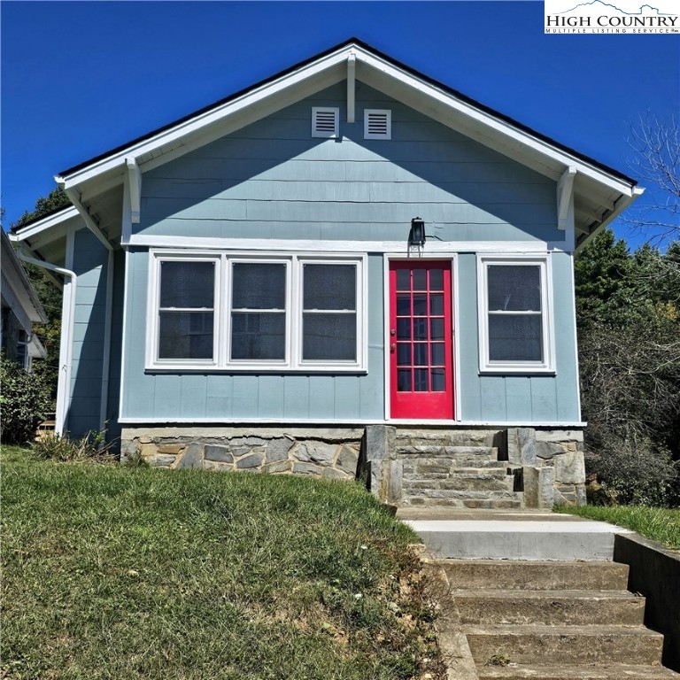 254 Green Street Boone, NC 28607 - Photo 1 of 48 a front view of a house with a yard