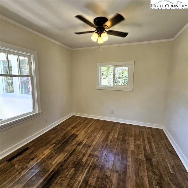 254 Green Street Boone, NC 28607 - Photo 23 of 48 a view of an empty room with wooden floor and a window