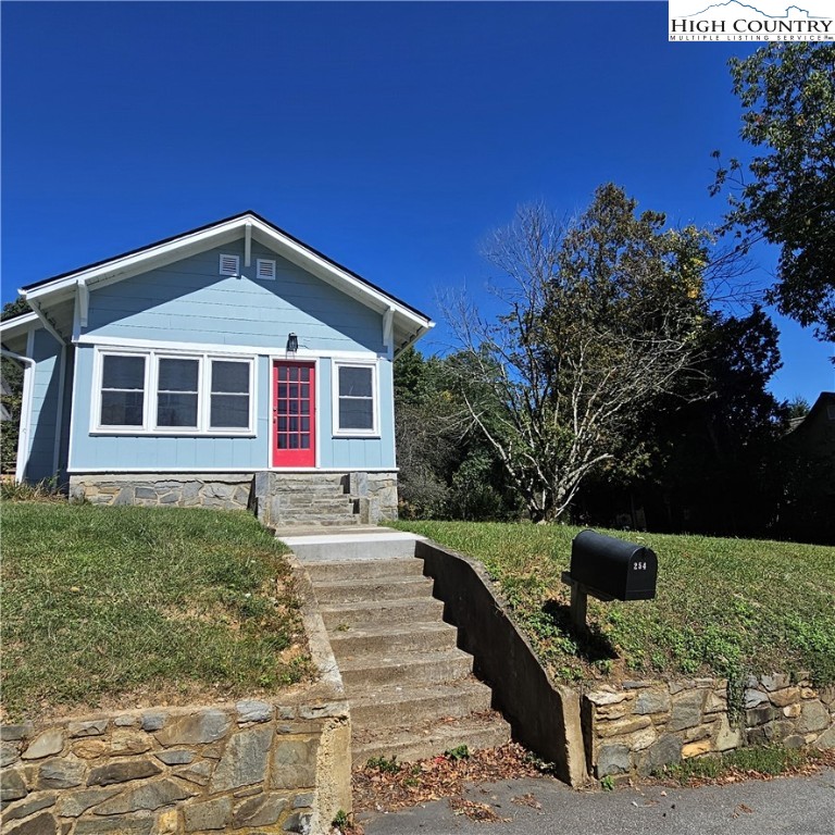 254 Green Street Boone, NC 28607 - Photo 3 of 48 a front view of a house with a yard