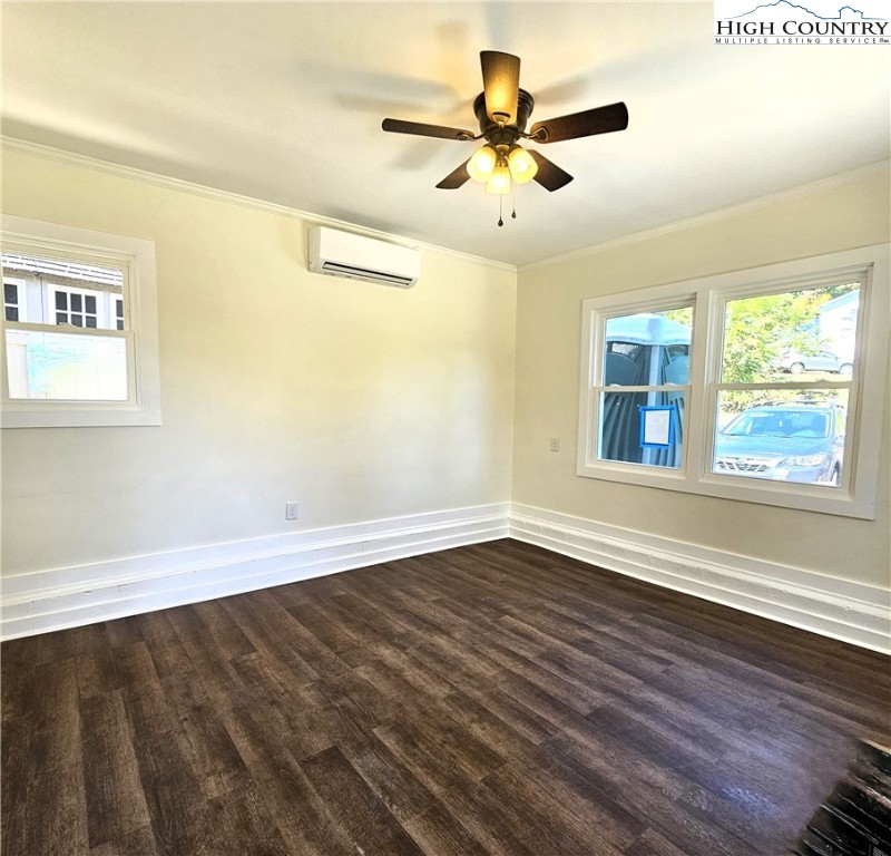 254 Green Street Boone, NC 28607 - Photo 40 of 48 a view of an empty room with wooden floor and a window