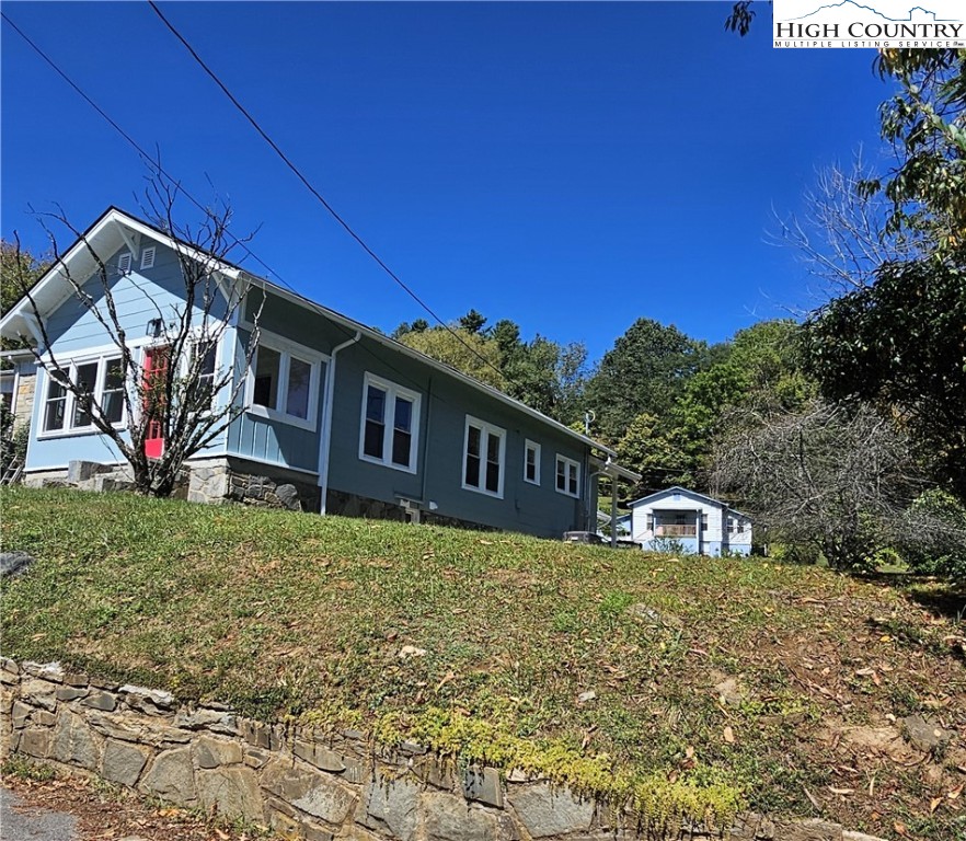 254 Green Street Boone, NC 28607 - Photo 4 of 48 a front view of a house with a yard