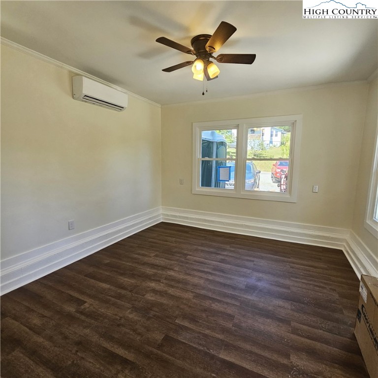 254 Green Street Boone, NC 28607 - Photo 41 of 48 an empty room with wooden floor and windows