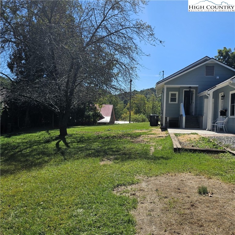 254 Green Street Boone, NC 28607 - Photo 6 of 48 a view of a house with a yard