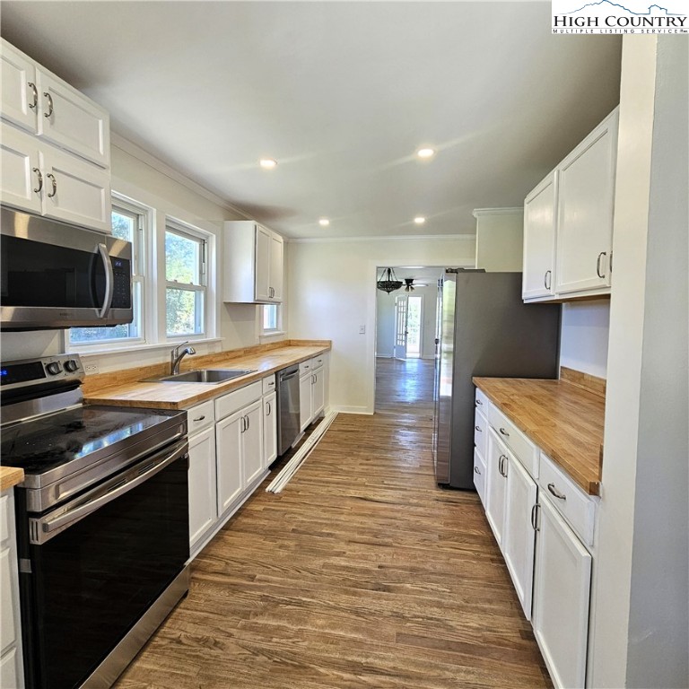 254 Green Street Boone, NC 28607 - Photo 7 of 48 a large kitchen with a stove top oven and sink