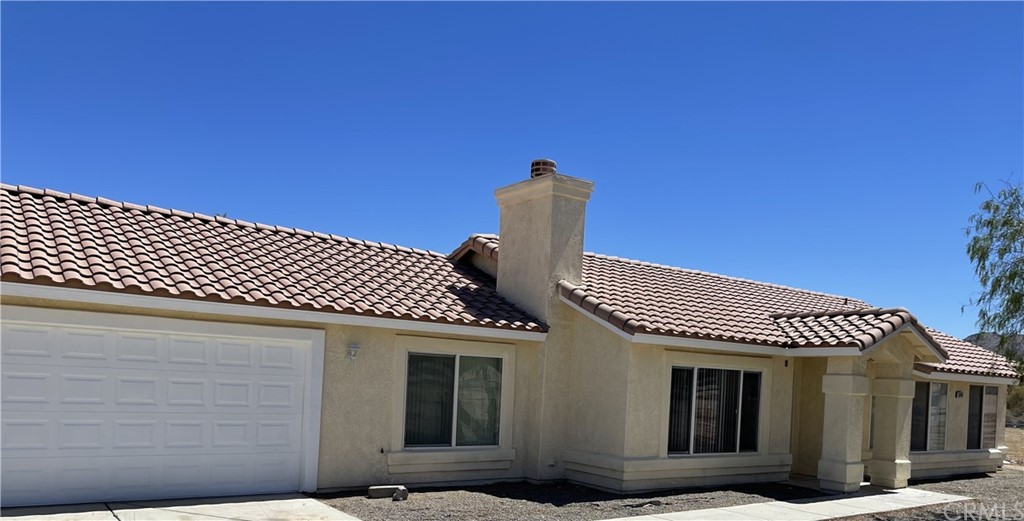 18404 Taloga Road Apple Valley, CA 92307 - Photo 1 of 1 a front view of a house