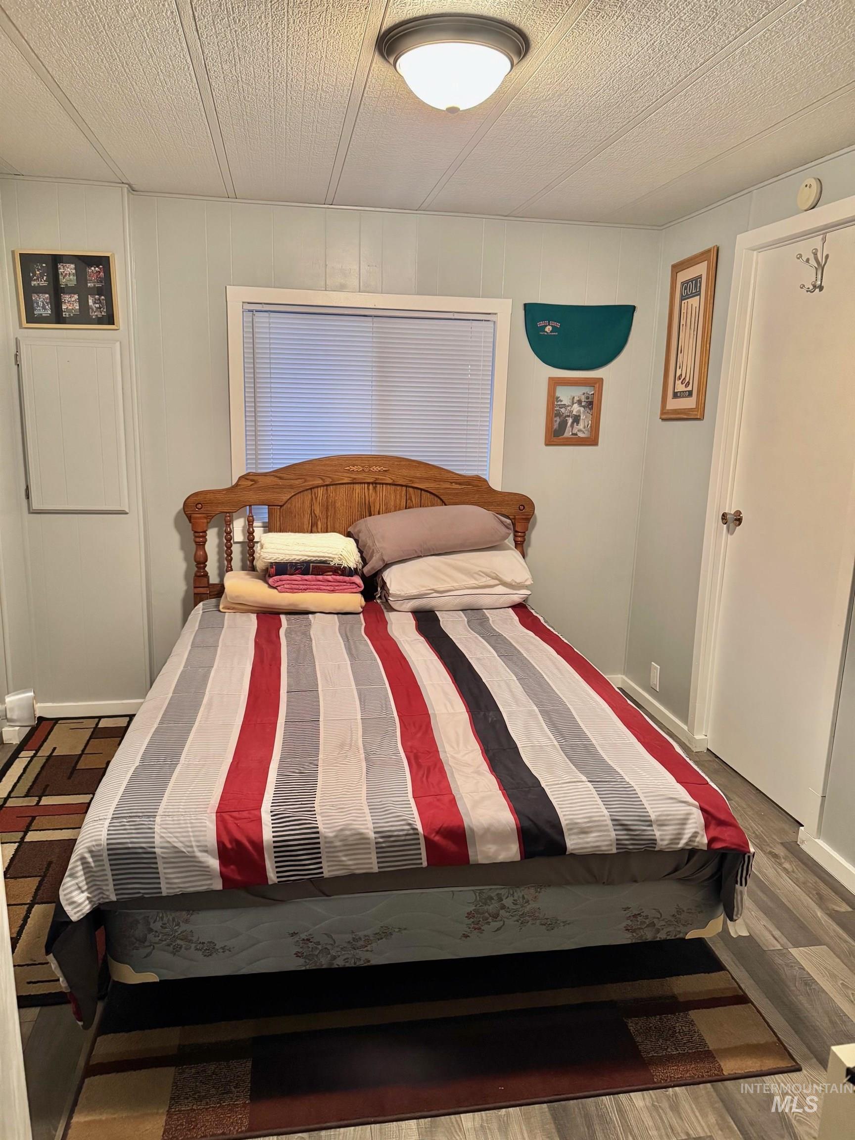 3181 West Alpine Street, Unit 22 Boise, ID 83705 - Photo 17 of 24 Bedroom featuring wood finished floors
