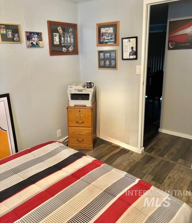 3181 West Alpine Street, Unit 22 Boise, ID 83705 - Photo 18 of 24 Bedroom with dark wood-style flooring