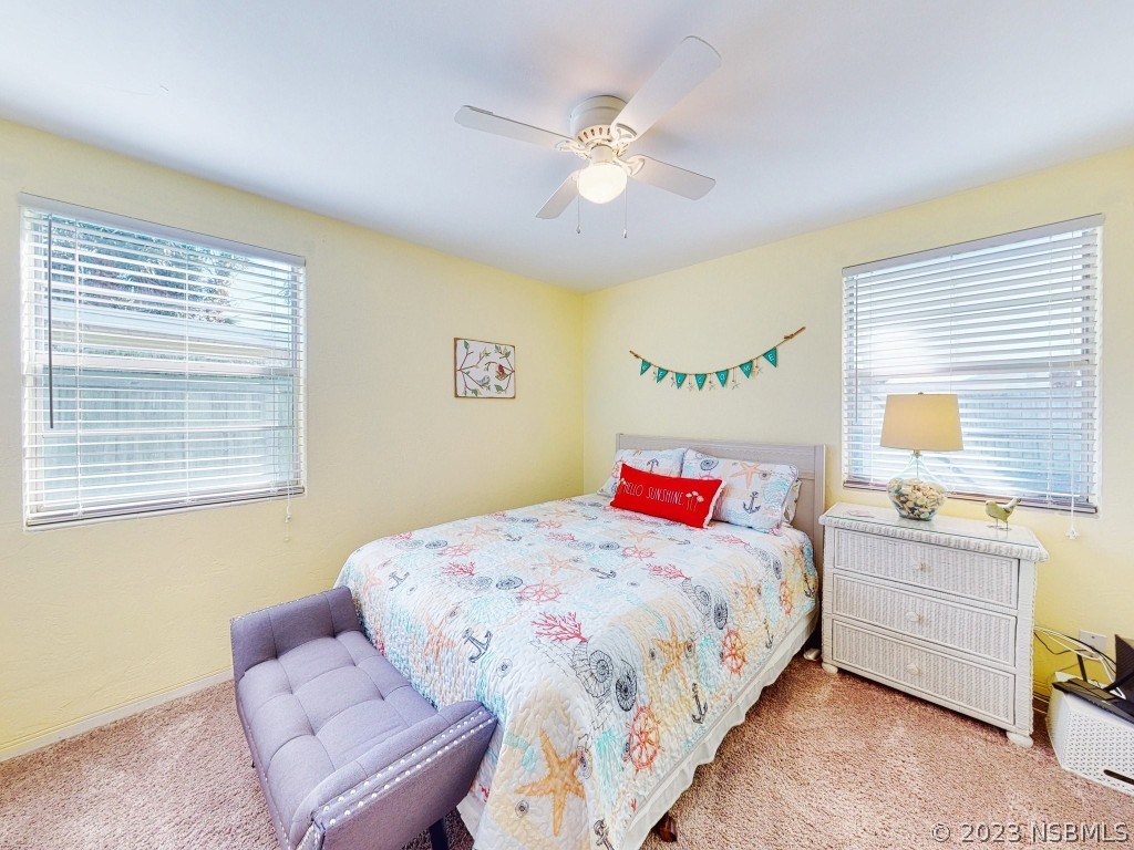 37 Ocean Shore Drive Ormond Beach, FL 32176 - Photo 20 of 50 a bedroom with a bed and window