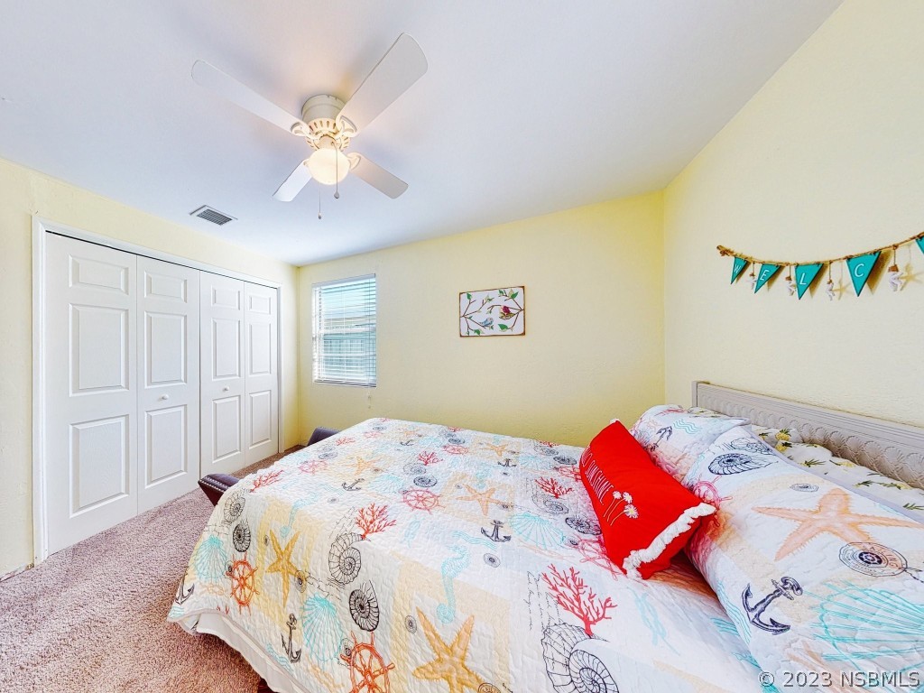 37 Ocean Shore Drive Ormond Beach, FL 32176 - Photo 22 of 50 a bedroom with a bed and a window