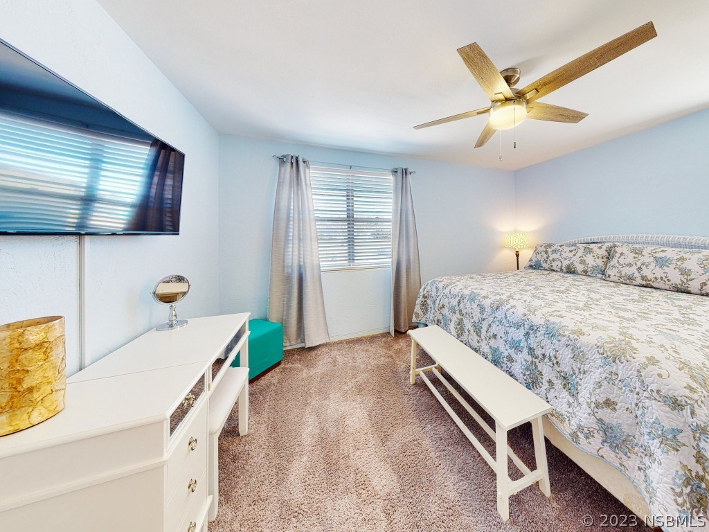 37 Ocean Shore Drive Ormond Beach, FL 32176 - Photo 25 of 50 a bedroom with a bed and a flat screen tv