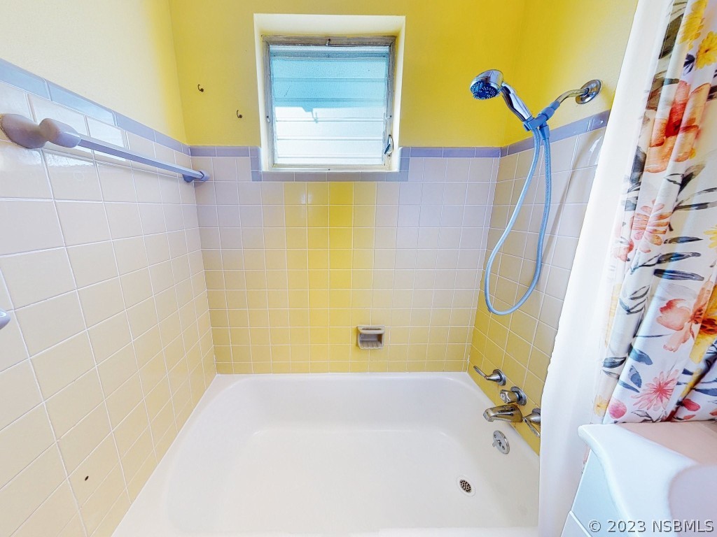 37 Ocean Shore Drive Ormond Beach, FL 32176 - Photo 27 of 50 a bathroom with a bathtub and a shower