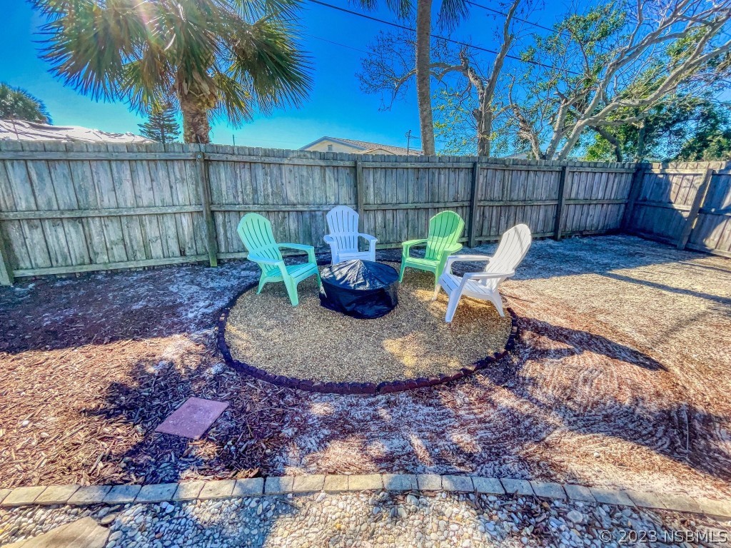 37 Ocean Shore Drive Ormond Beach, FL 32176 - Photo 38 of 50 a view of a backyard with furniture and outdoor seating