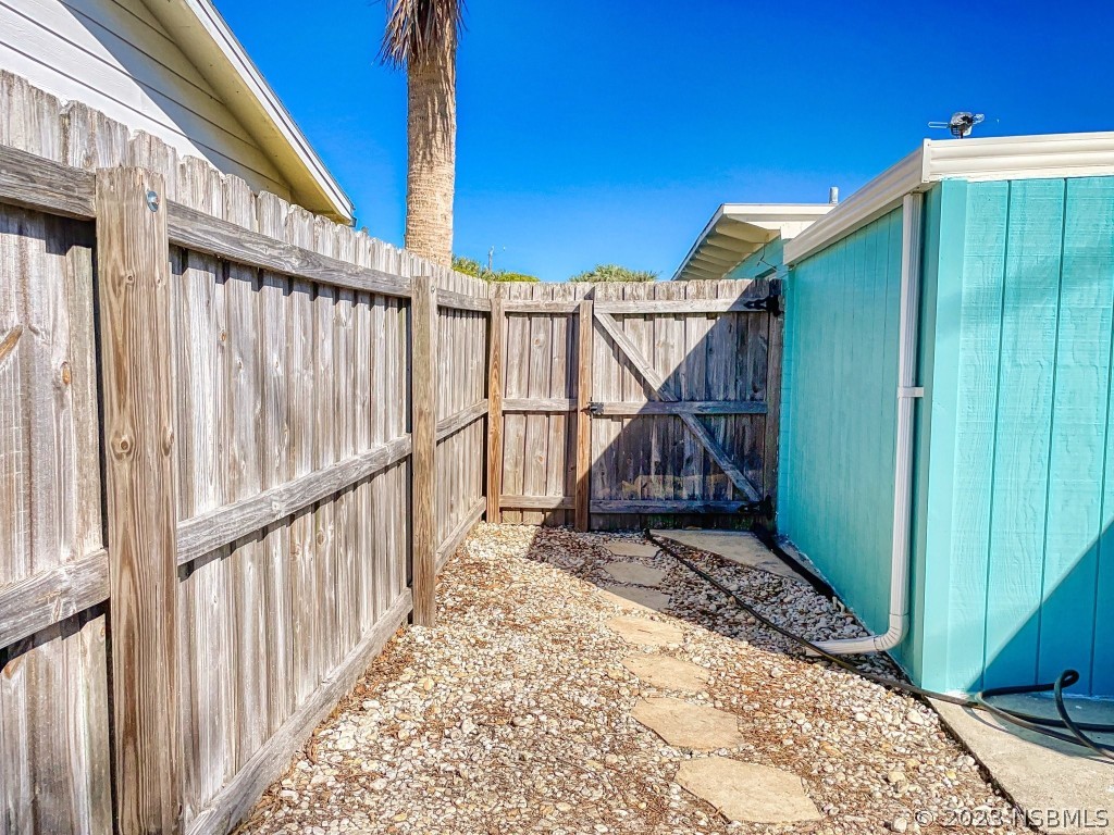 37 Ocean Shore Drive Ormond Beach, FL 32176 - Photo 42 of 50 a view of a house with wooden floor in a backyard