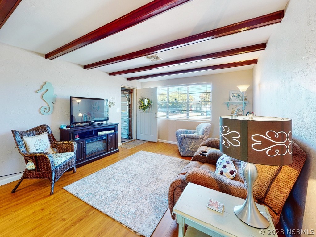 37 Ocean Shore Drive Ormond Beach, FL 32176 - Photo 8 of 50 a living room with furniture and a wooden floor
