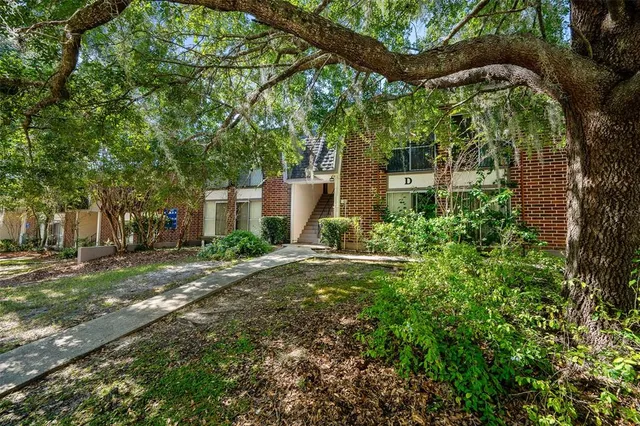 a view of a house with a tree