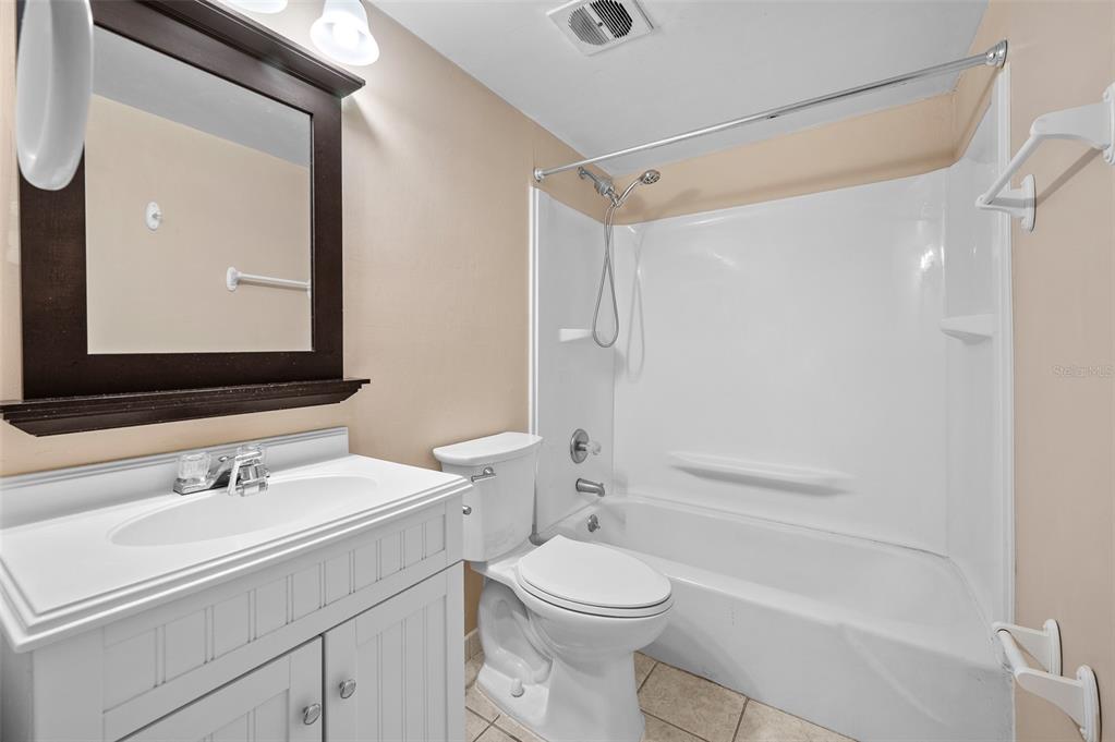 1700 Southwest 16th Court, Unit D24 Gainesville, FL 32608 - Photo 18 of 25 a bathroom with a sink a toilet and shower