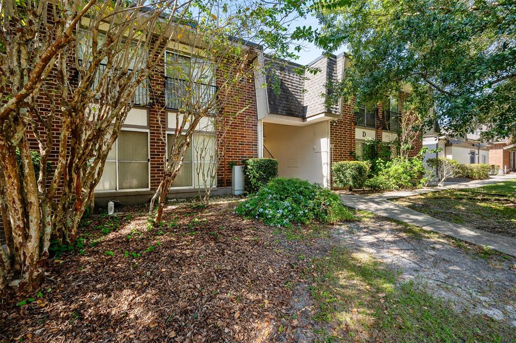 1700 Southwest 16th Court, Unit D24 Gainesville, FL 32608 - Photo 2 of 25 a view of a house with a yard