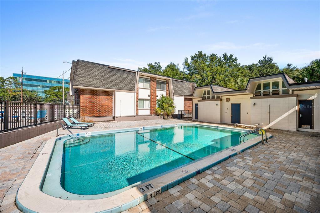 1700 Southwest 16th Court, Unit D24 Gainesville, FL 32608 - Photo 23 of 25 a view of a house with a swimming pool