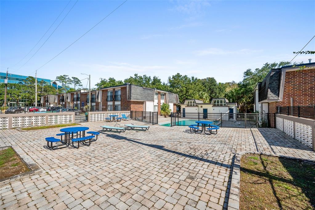 1700 Southwest 16th Court, Unit D24 Gainesville, FL 32608 - Photo 24 of 25 a view of a swimming pool with a patio