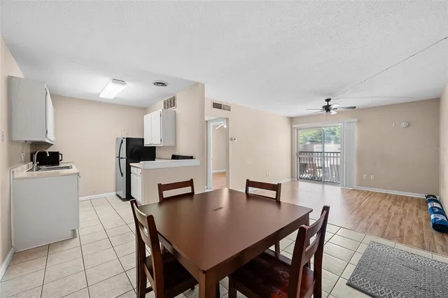 a kitchen with a sink stove and refrigerator