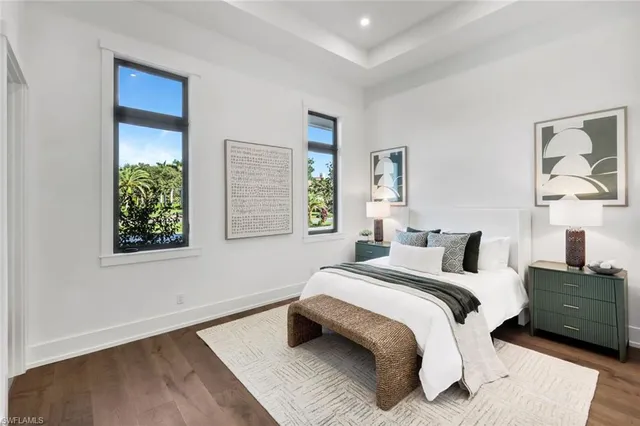 a bathroom with a granite countertop sink mirror vanity and toilet
