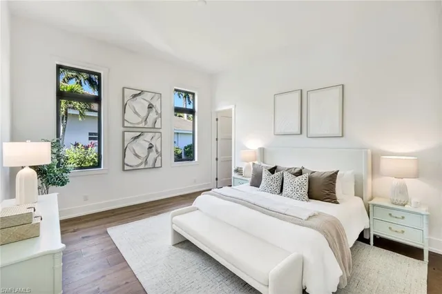 a bathroom with a granite countertop sink vanity mirror and shower