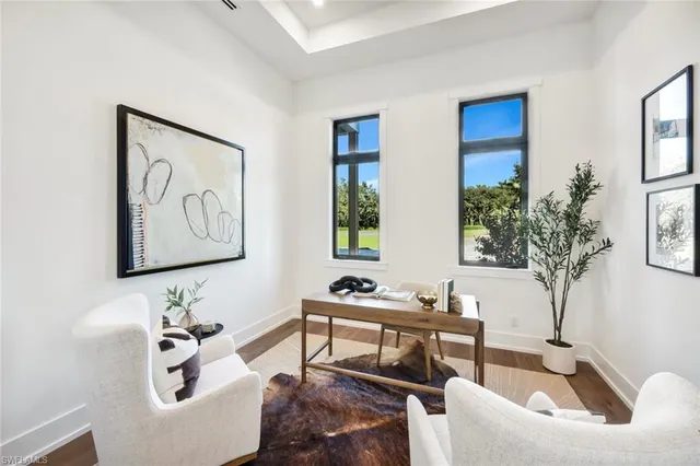 a bathroom with a toilet sink vanity and mirror