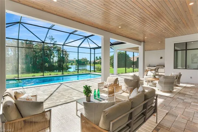 a building outdoor space with patio furniture and garden