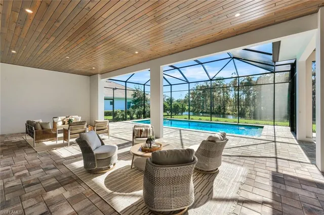 a view of a swimming pool with a yard