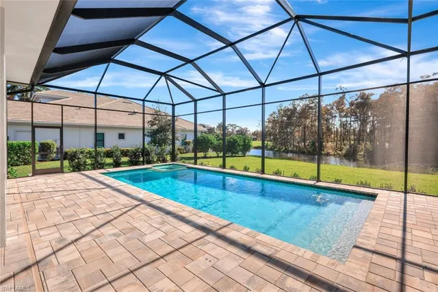 a view of a swimming pool with a yard