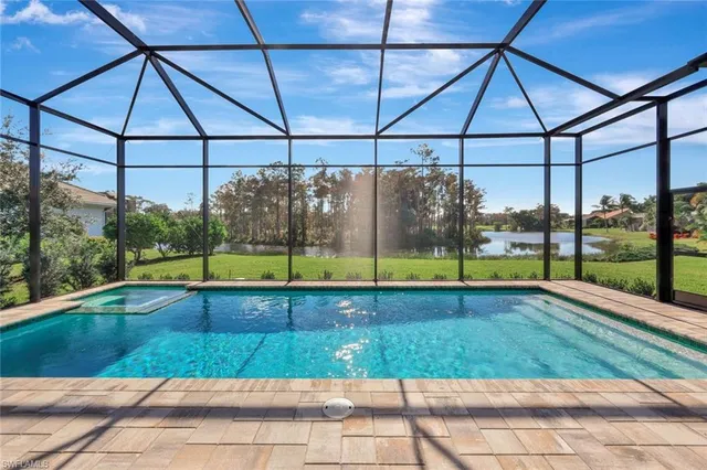 a view of swimming pool with a patio