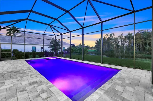 a view of swimming pool with outdoor seating