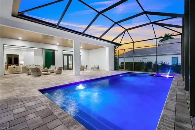 a view of swimming pool with outdoor seating