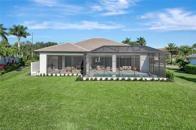 a view of a big yard with a large tree