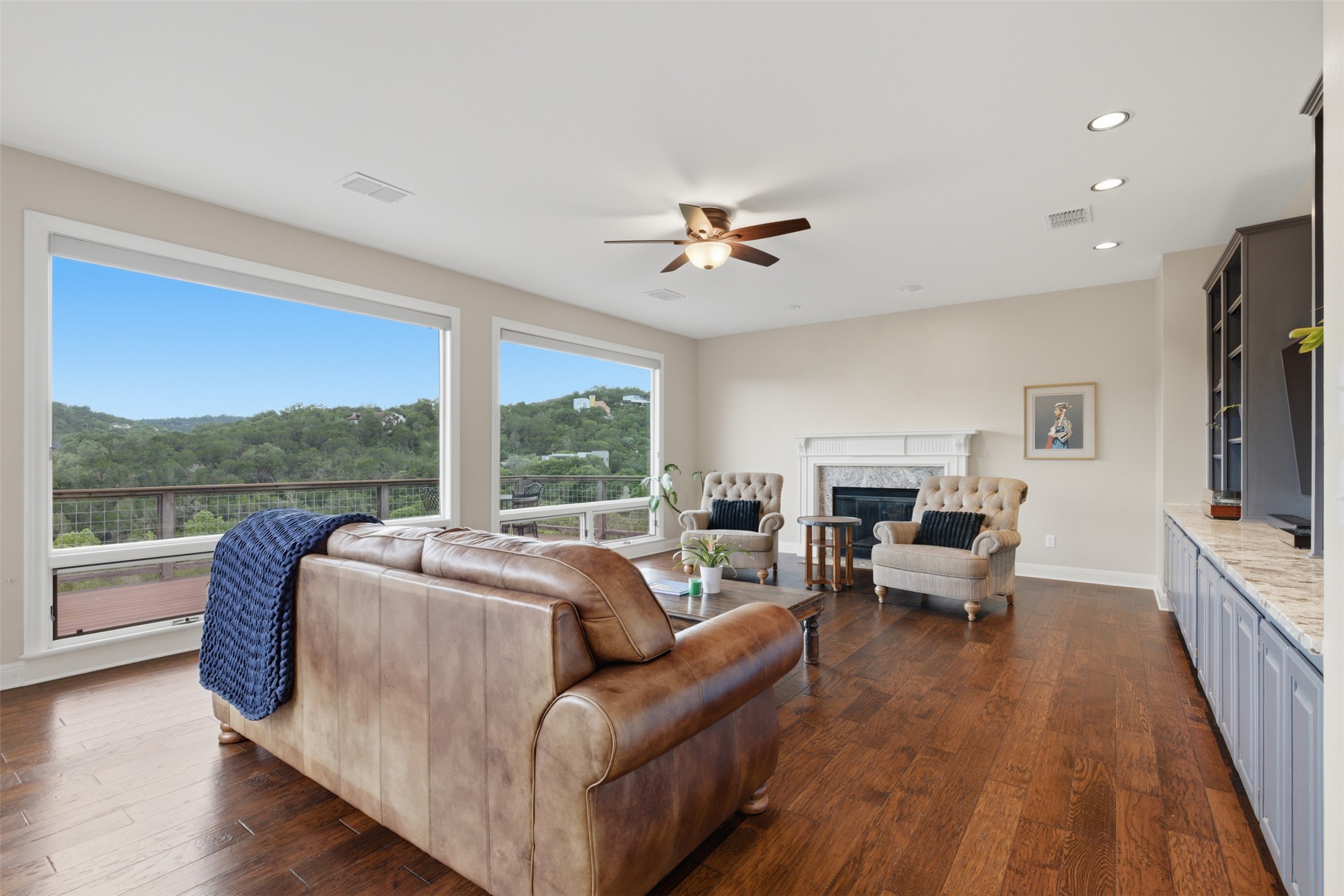 1504 Twilight Ridge Drive Austin, TX 78746 - Photo 4 of 30 Big picture windows highlight the views from living, kitchen, dining, office & primary.