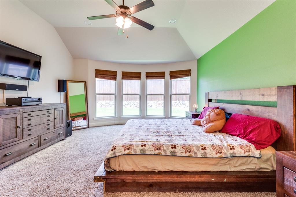 2364 Mare Road Carrollton, TX 75010 - Photo 21 of 25 a bedroom with a bed and a large window