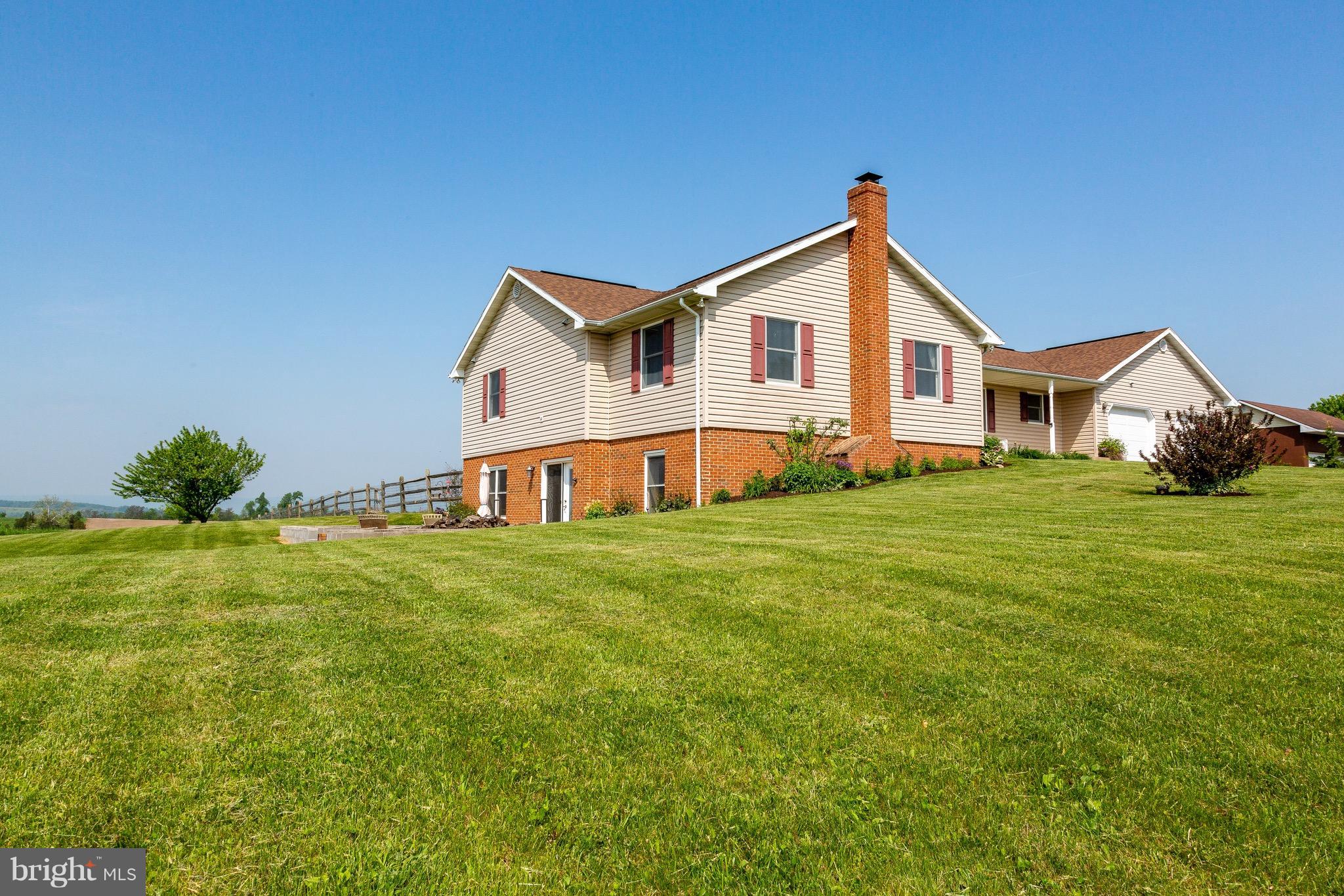 11428 Hill Road Keymar, MD 21757 - Photo 1 of 30 a front view of a house with yard and green space