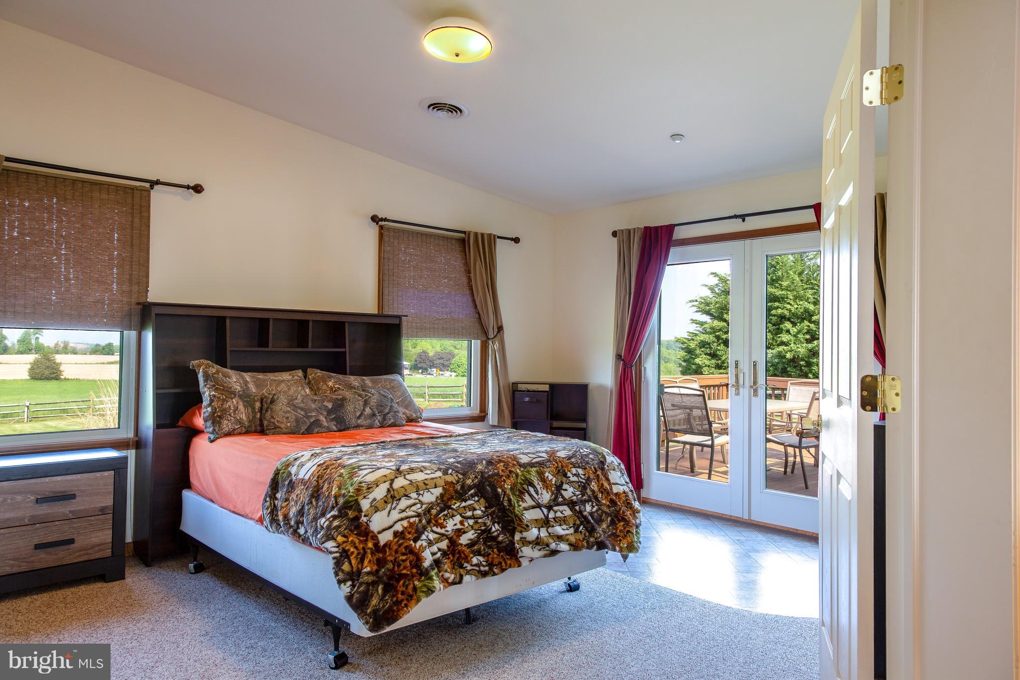 11428 Hill Road Keymar, MD 21757 - Photo 12 of 30 a bedroom with a bed and a night stand