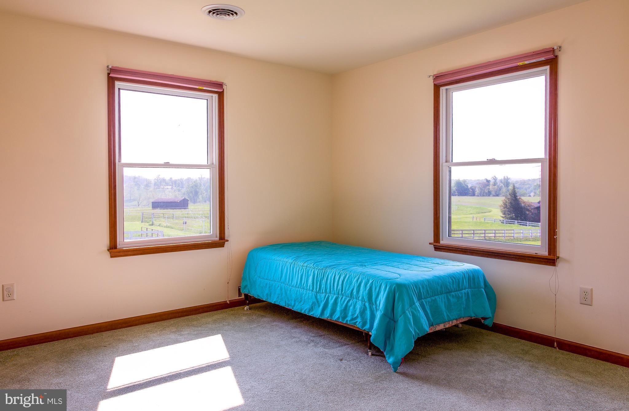 11428 Hill Road Keymar, MD 21757 - Photo 18 of 30 a bedroom with a bed and a window