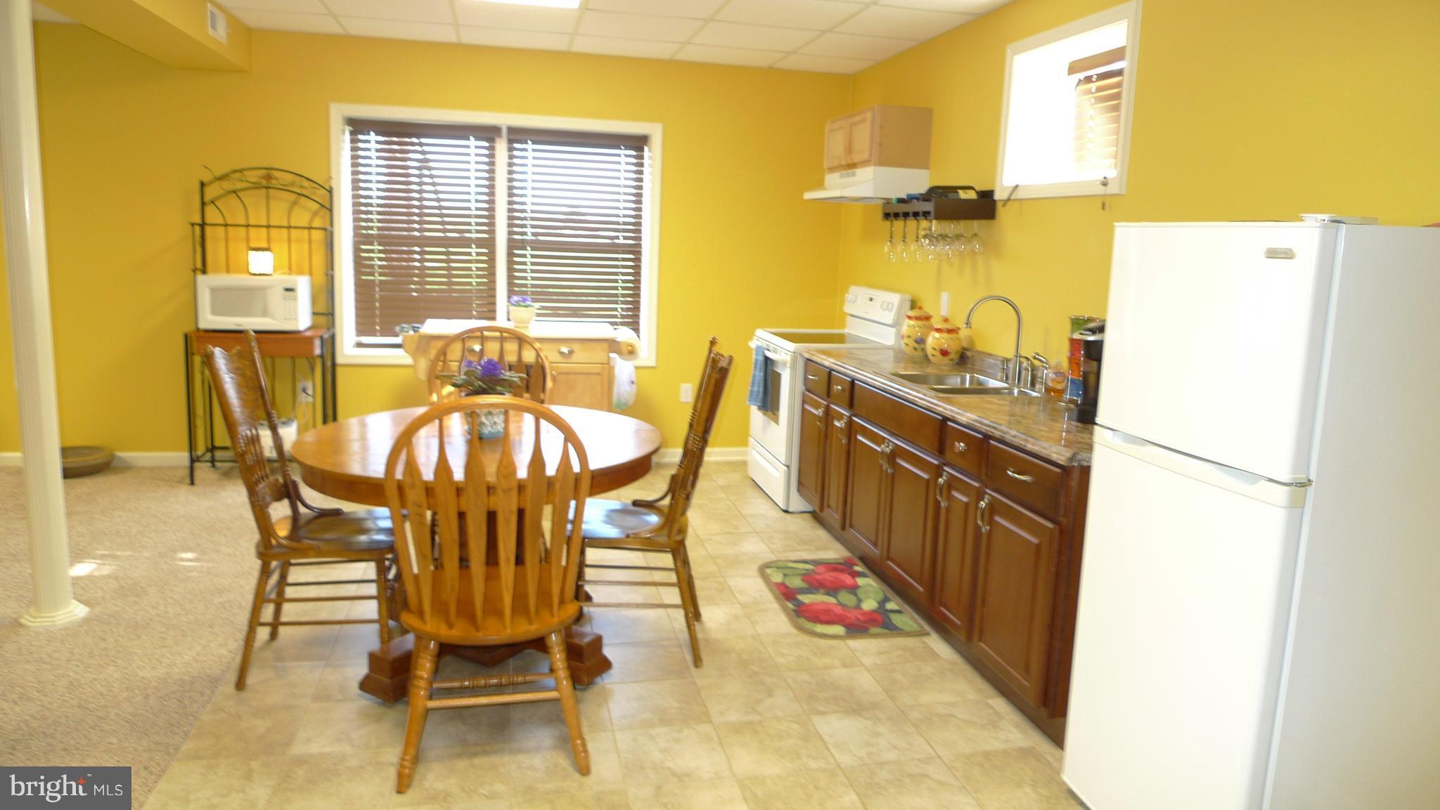 11428 Hill Road Keymar, MD 21757 - Photo 22 of 30 a view of a dining room with furniture and a window