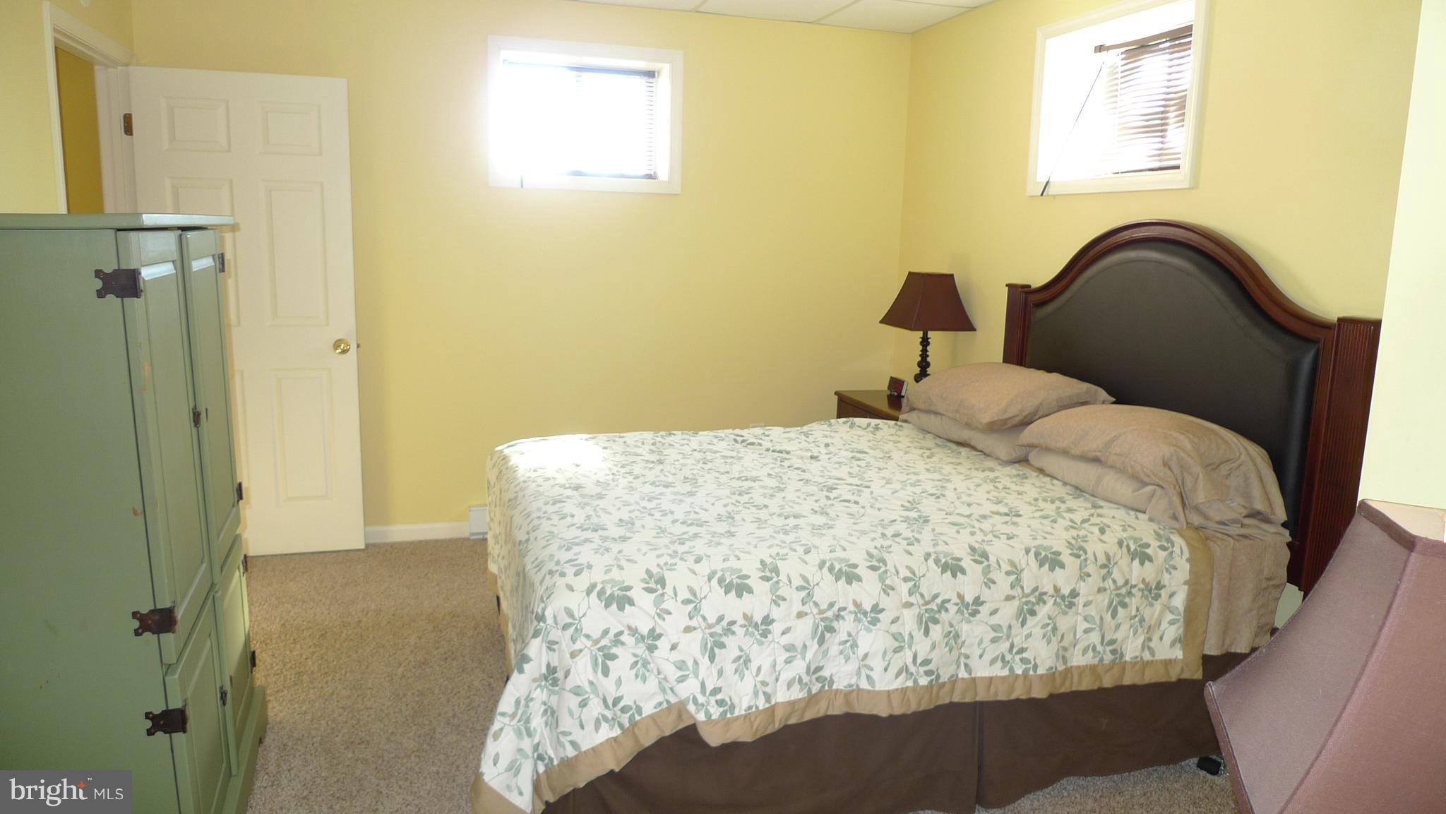 11428 Hill Road Keymar, MD 21757 - Photo 23 of 30 a bedroom with a bed and a painting on the wall