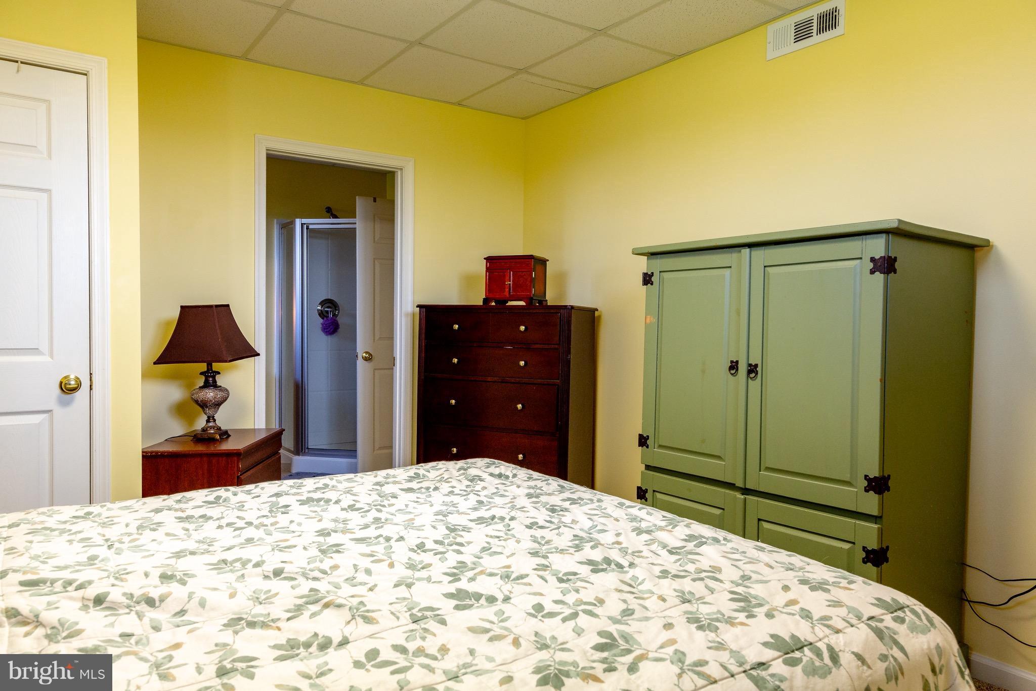 11428 Hill Road Keymar, MD 21757 - Photo 24 of 30 a bedroom with a bed and a mirror