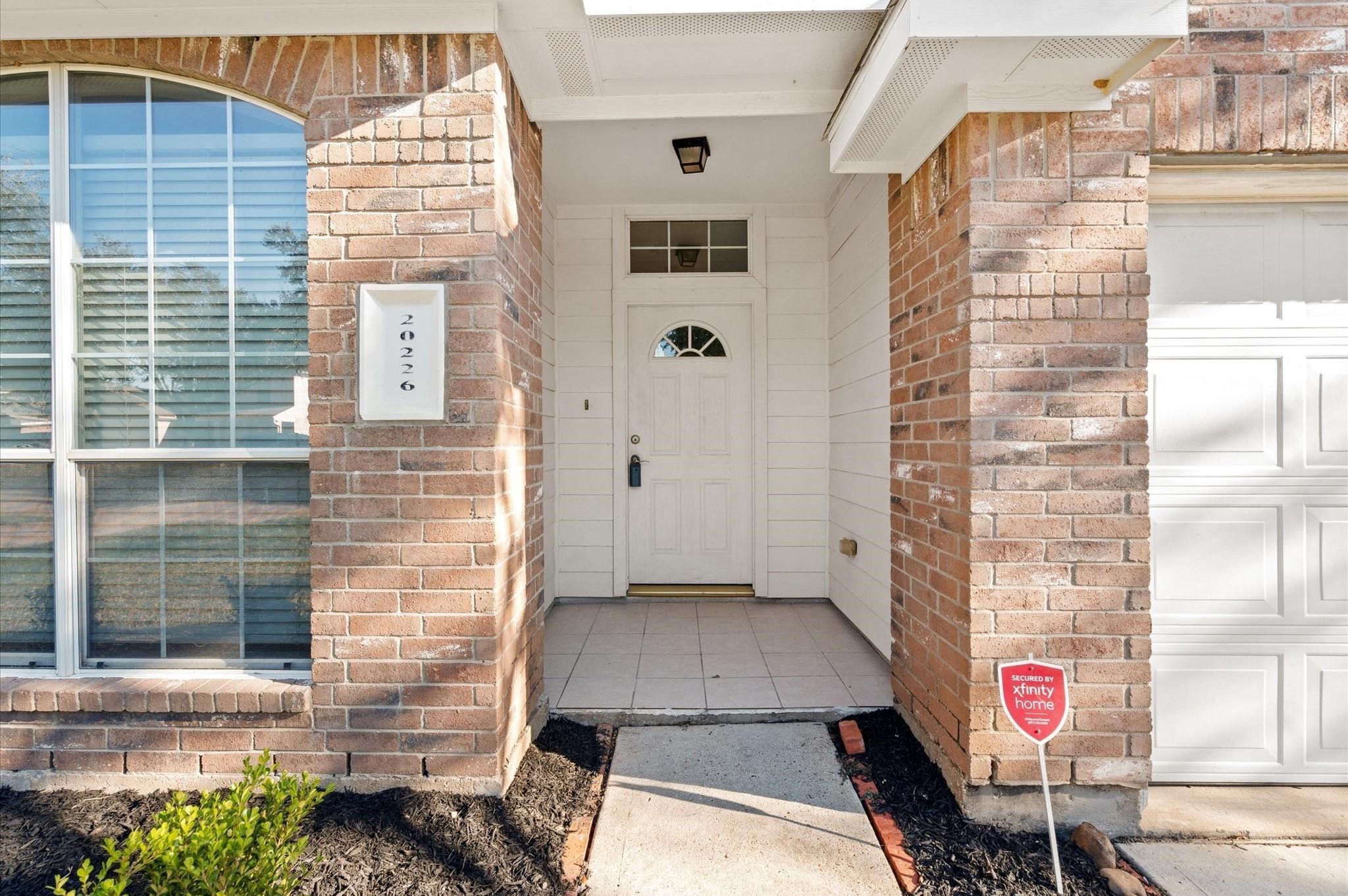 20226 Sunset Ranch Drive Katy, TX 77449 - Photo 2 of 27 a front view of a house with entryway