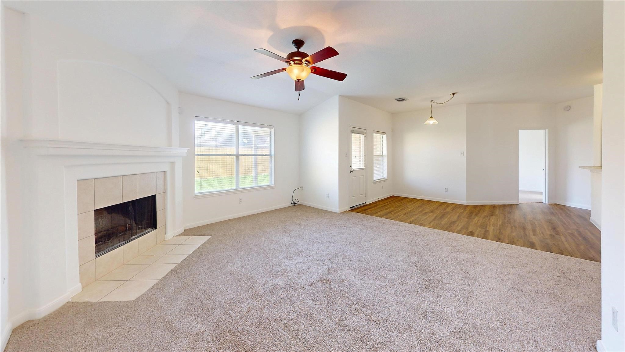 20226 Sunset Ranch Drive Katy, TX 77449 - Photo 7 of 27 a view of an empty room with a fireplace and a window