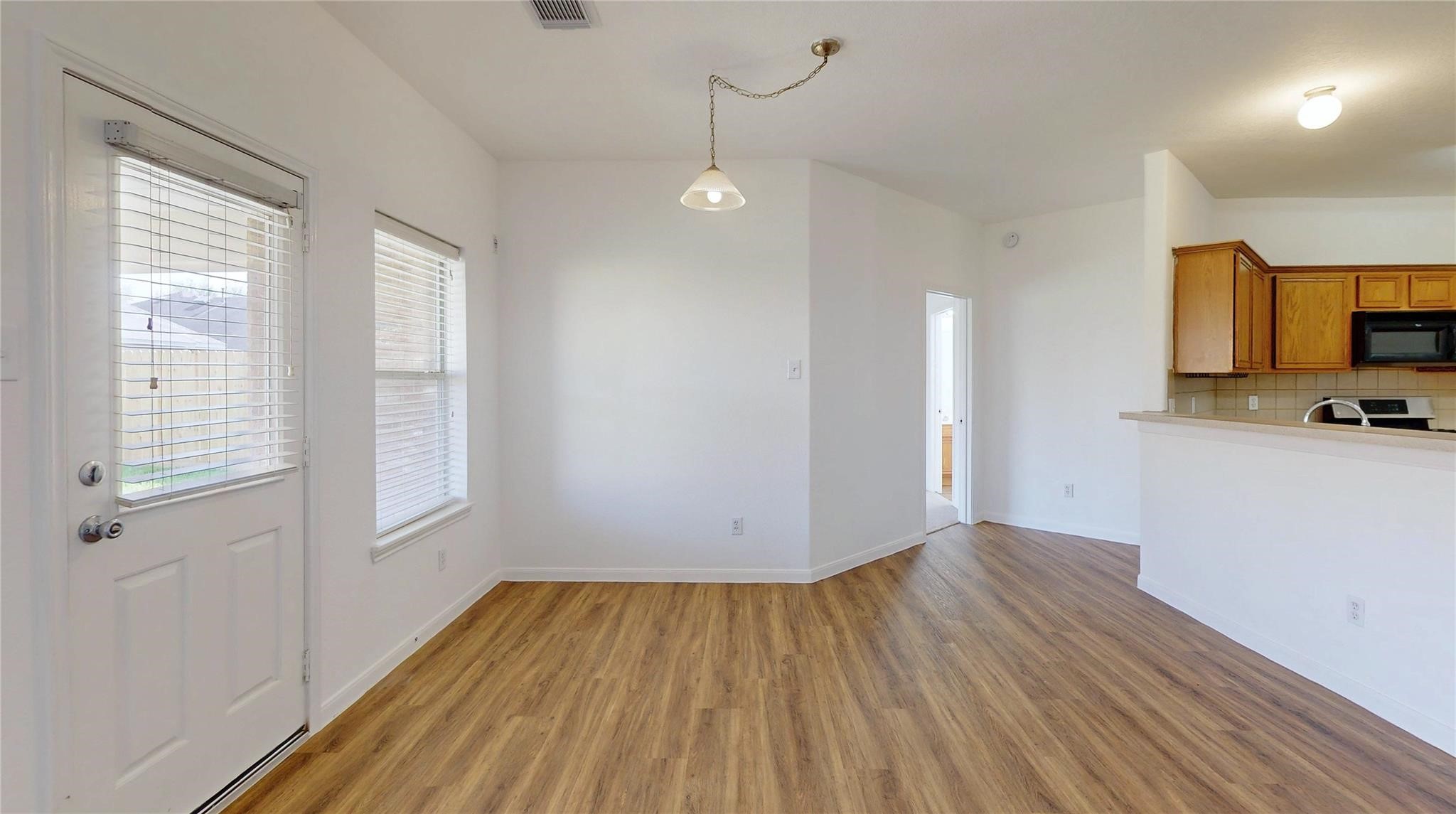 20226 Sunset Ranch Drive Katy, TX 77449 - Photo 8 of 27 a view of empty room with wooden floor and fan
